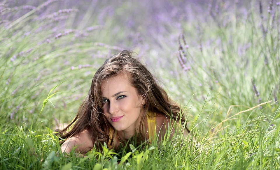 beautiful girl wearing yellow shirt on the grass